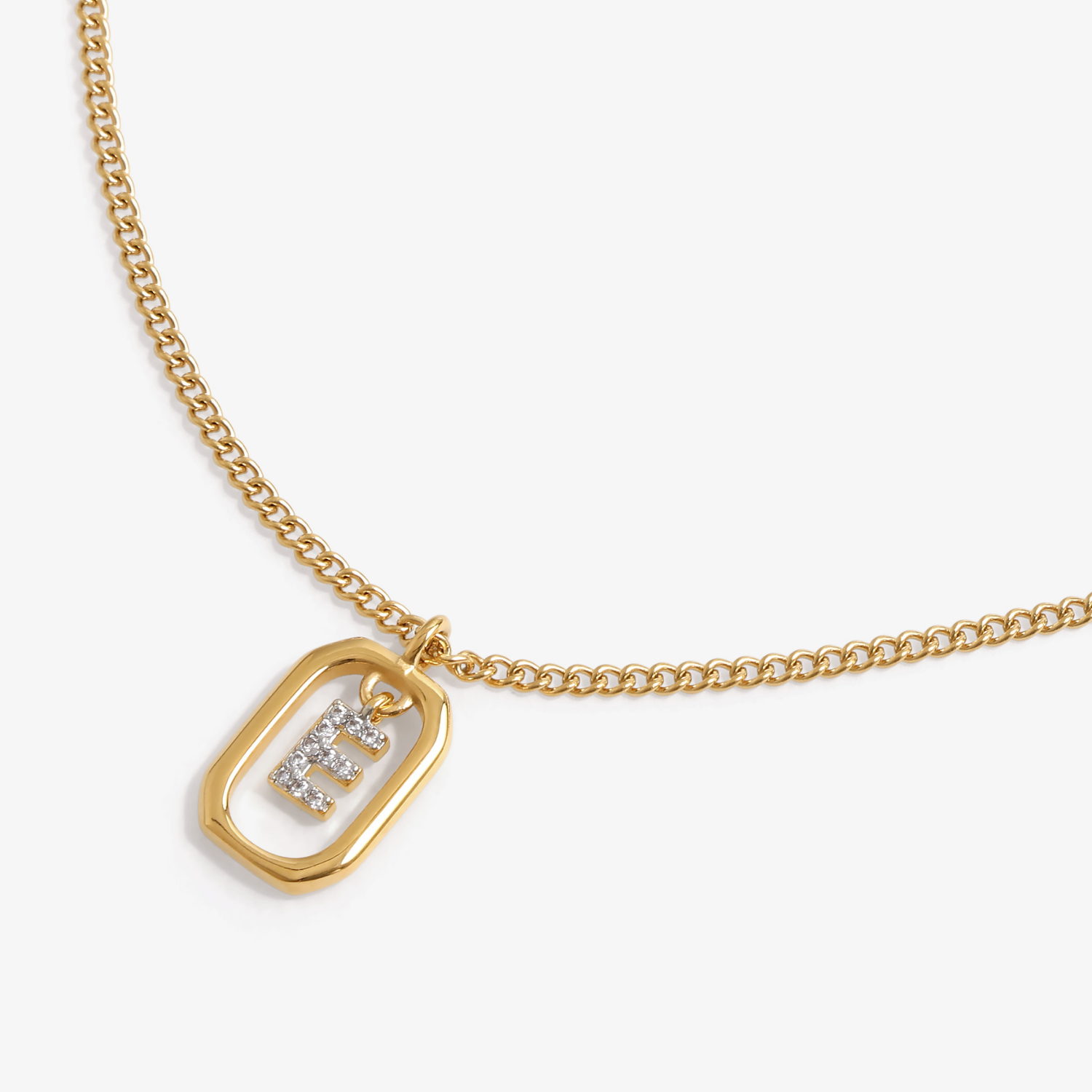 Initial E zirconia necklace flat lay – personalized letter E sparkling jewelry VECINO