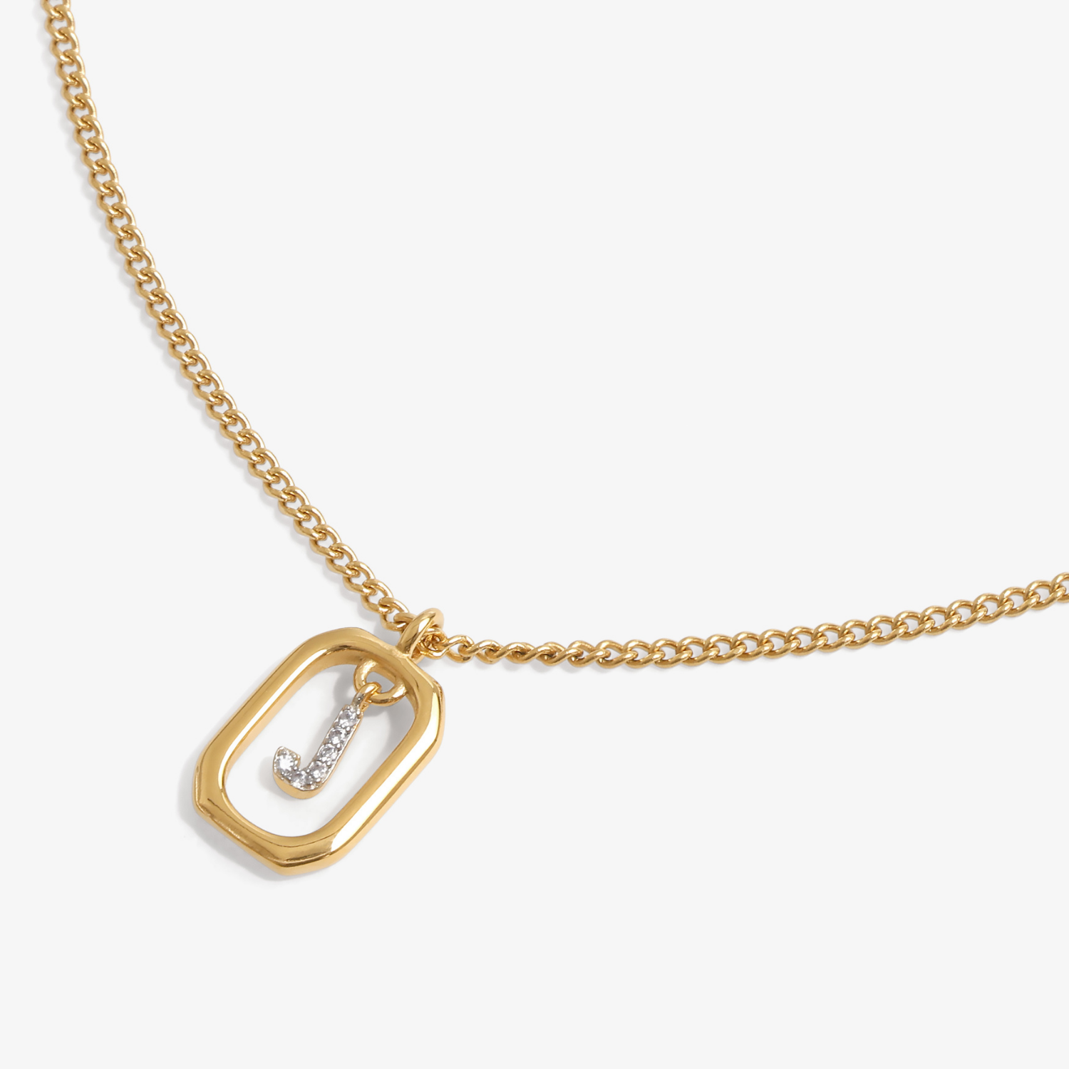 Initial J zirconia necklace flat lay – personalized letter J sparkling jewelry VECINO