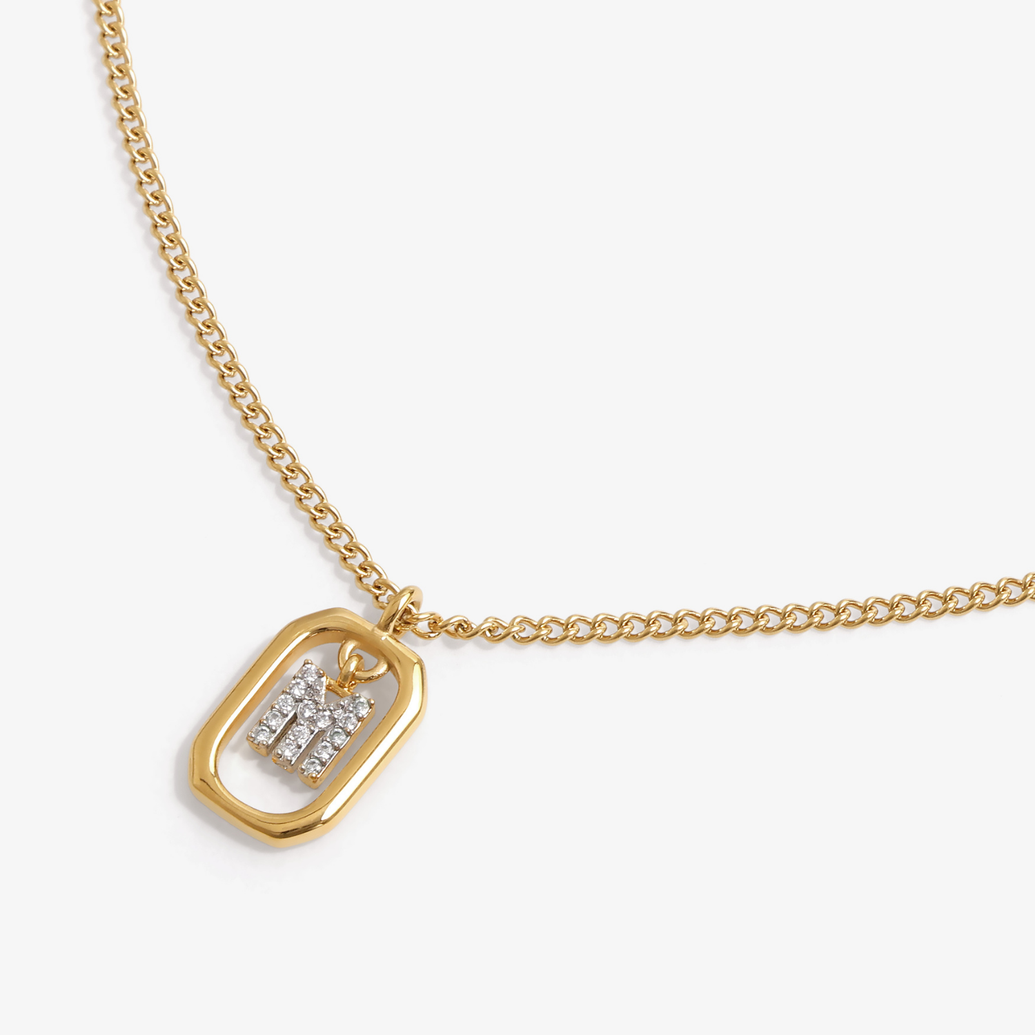 Initial M zirconia necklace flat lay – personalized letter M sparkling jewelry VECINO