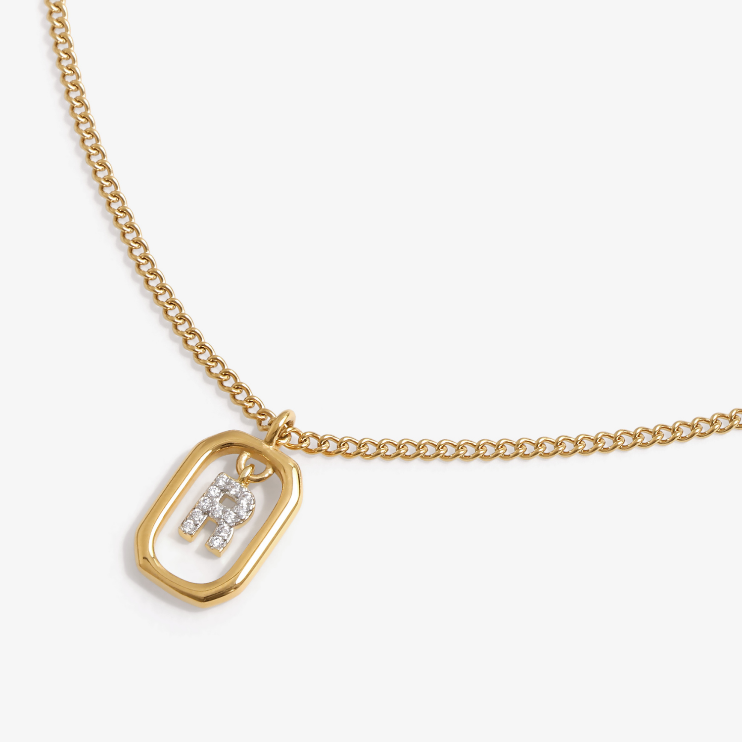 Initial R zirconia necklace flat lay – personalized letter R sparkling jewelry VECINO