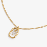 Initial V zirconia necklace flat lay – personalized letter V sparkling jewelry VECINO