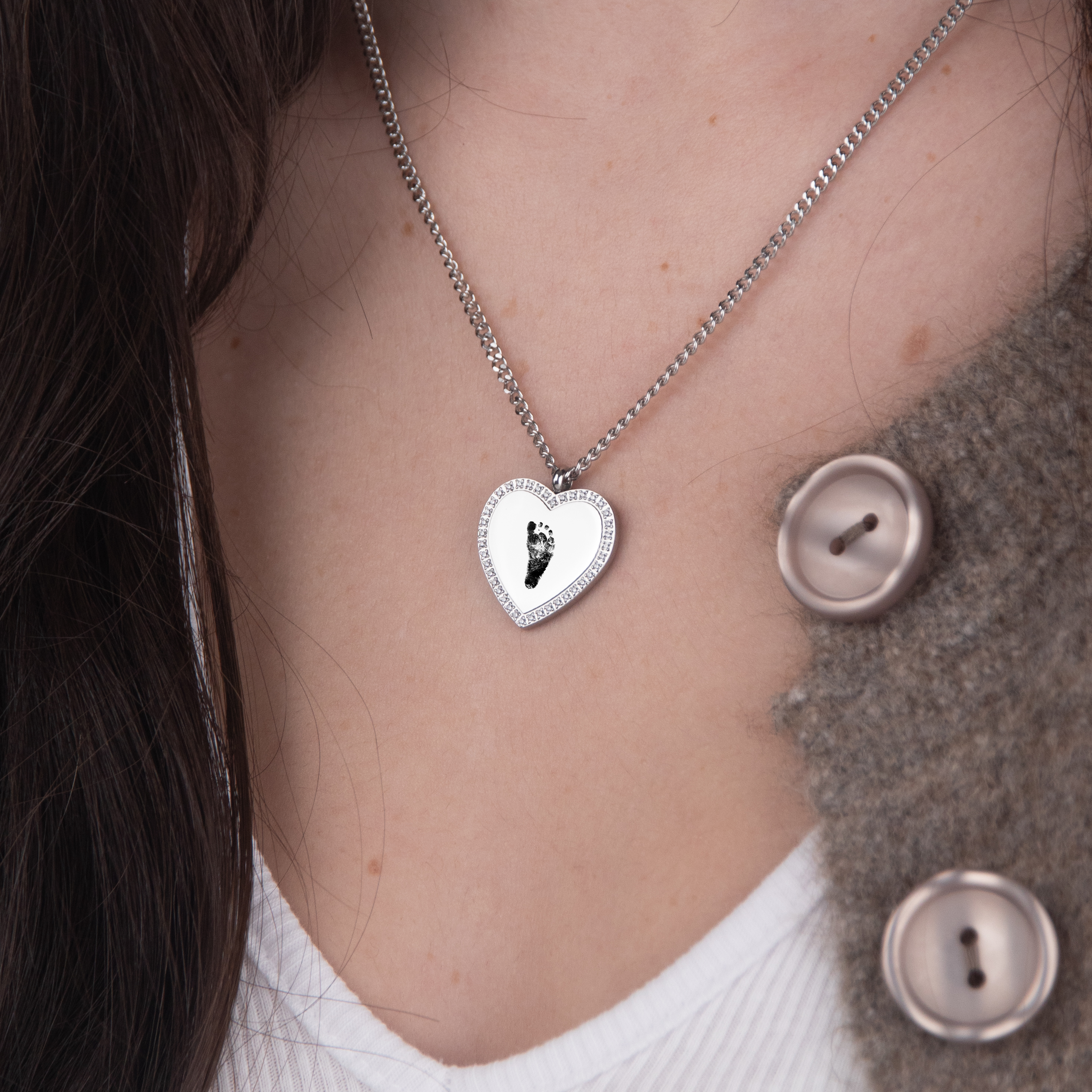 Silver zirconia heart necklace footprint flat lay – personalized keepsake VECINO