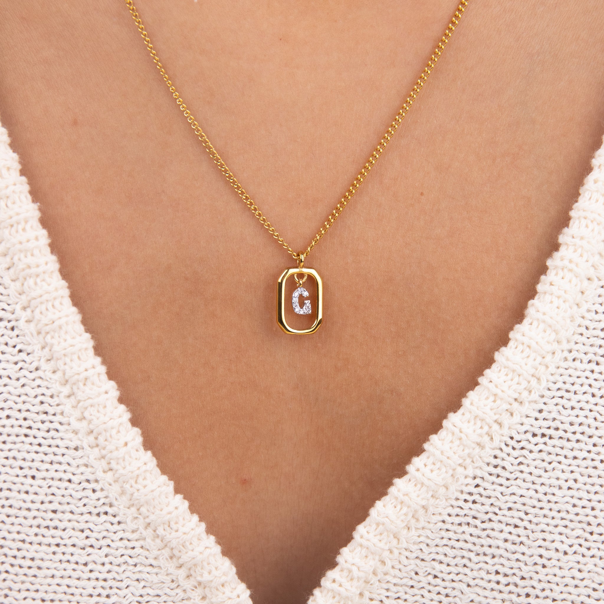 Initial G zirconia necklace worn on neck – personalized luxury jewelry VECINO
