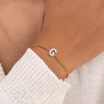 Initial G zirconia bracelet worn on wrist – personalized luxury jewelry VECINO