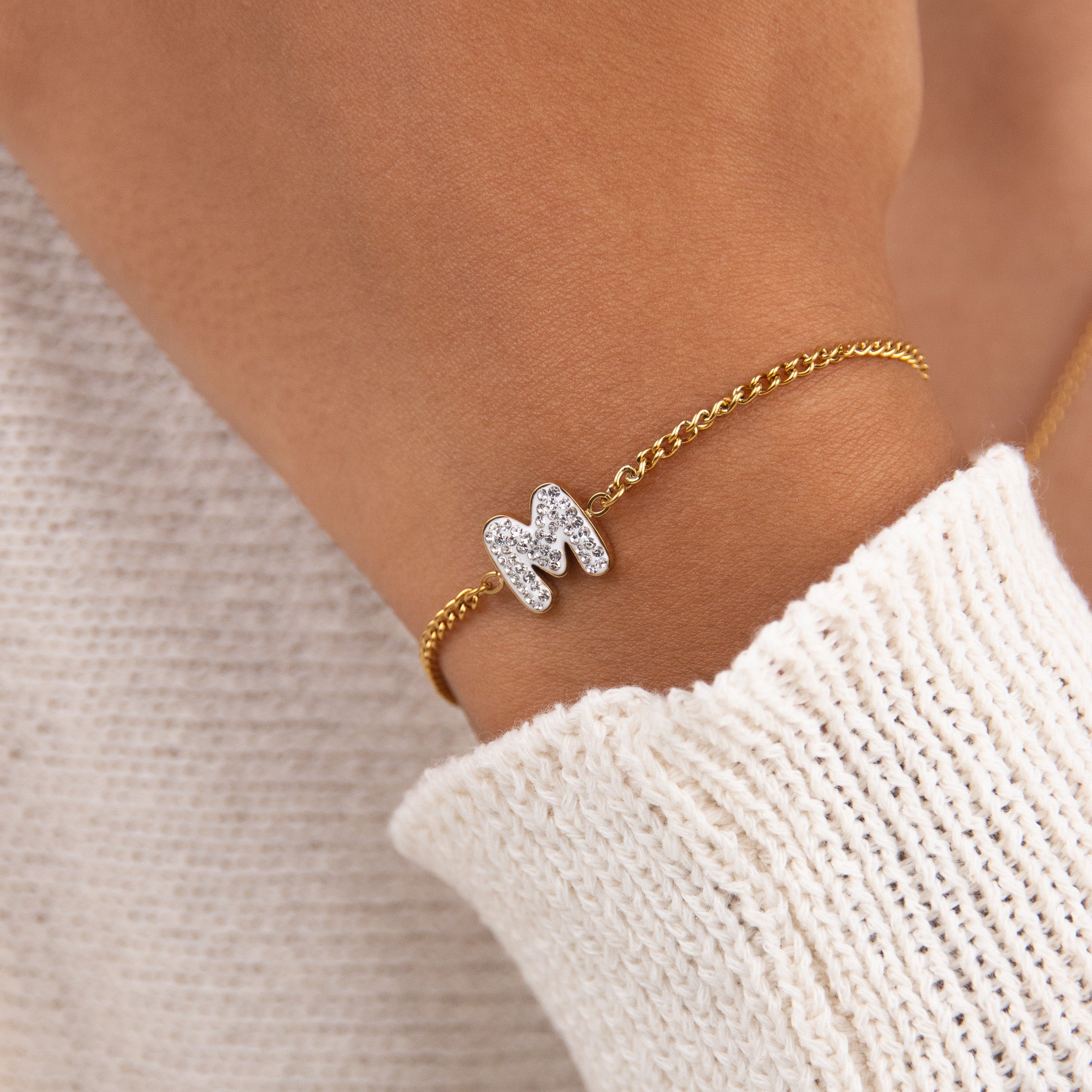 Initial M zirconia bracelet worn on wrist – personalized luxury jewelry VECINO