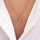 Initial E zirconia necklace worn on neck – personalized luxury jewelry VECINO
