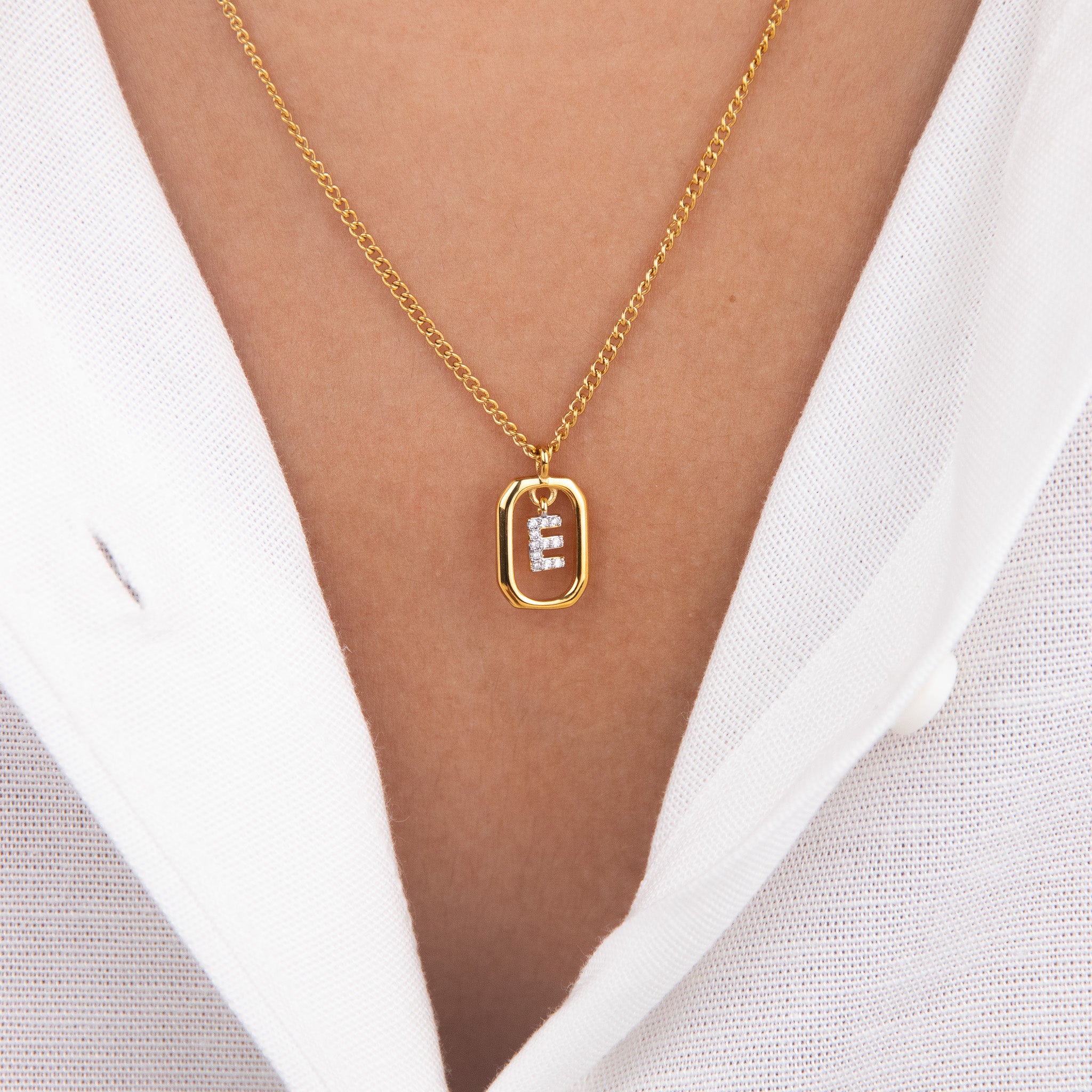 Initial E zirconia necklace worn on neck – personalized luxury jewelry VECINO