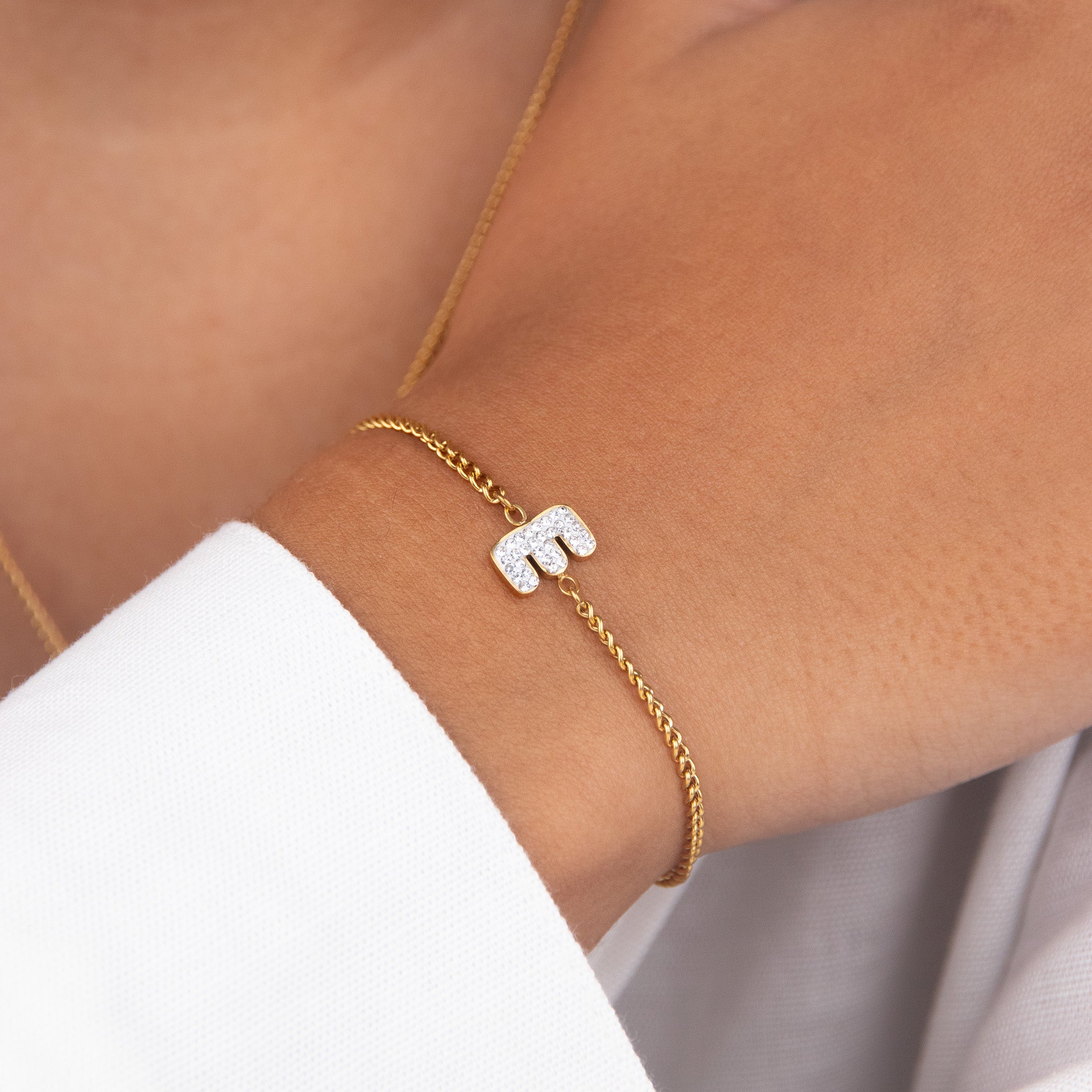 Initial E zirconia bracelet worn on wrist – personalized luxury jewelry VECINO