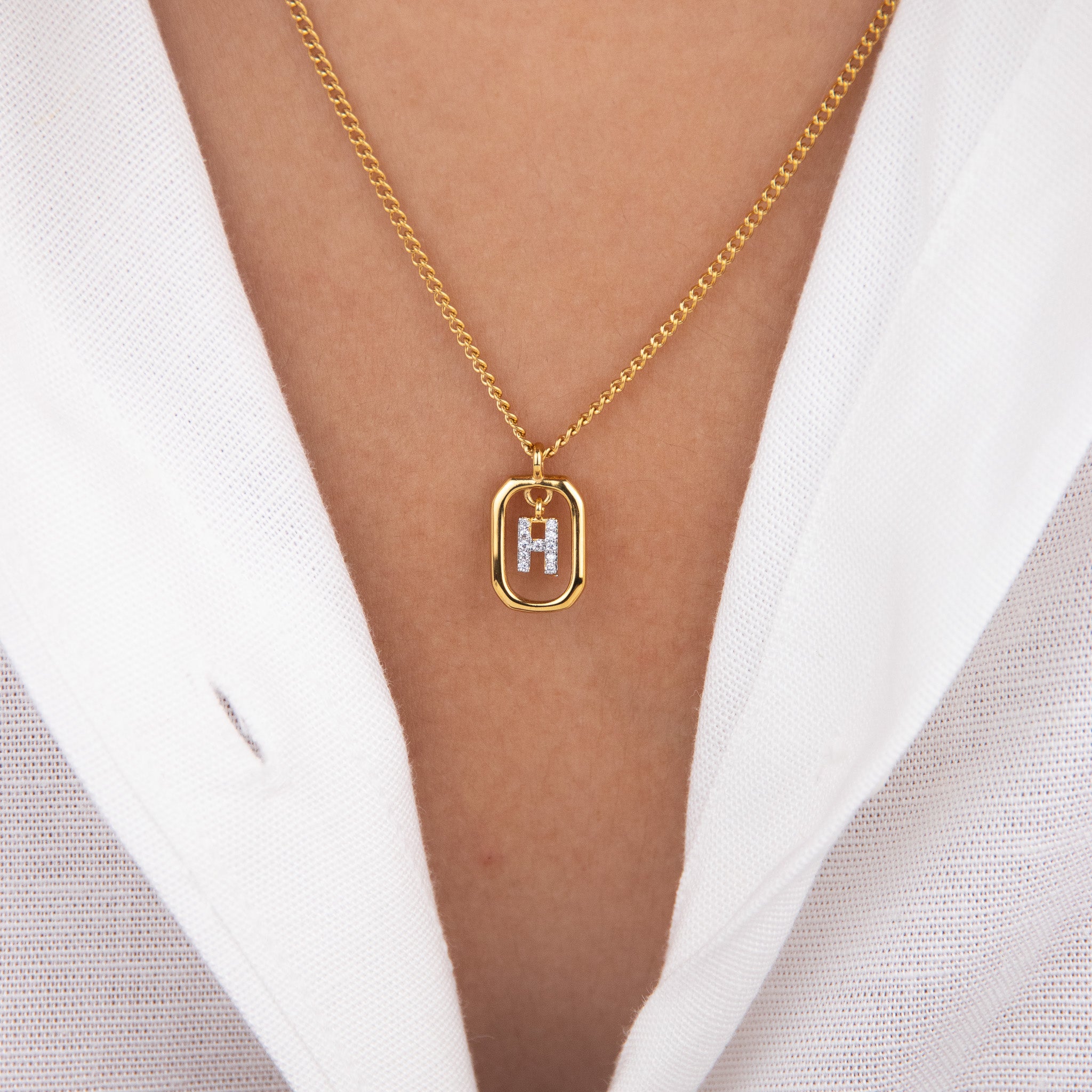 Initial H zirconia necklace worn on neck – personalized luxury jewelry VECINO