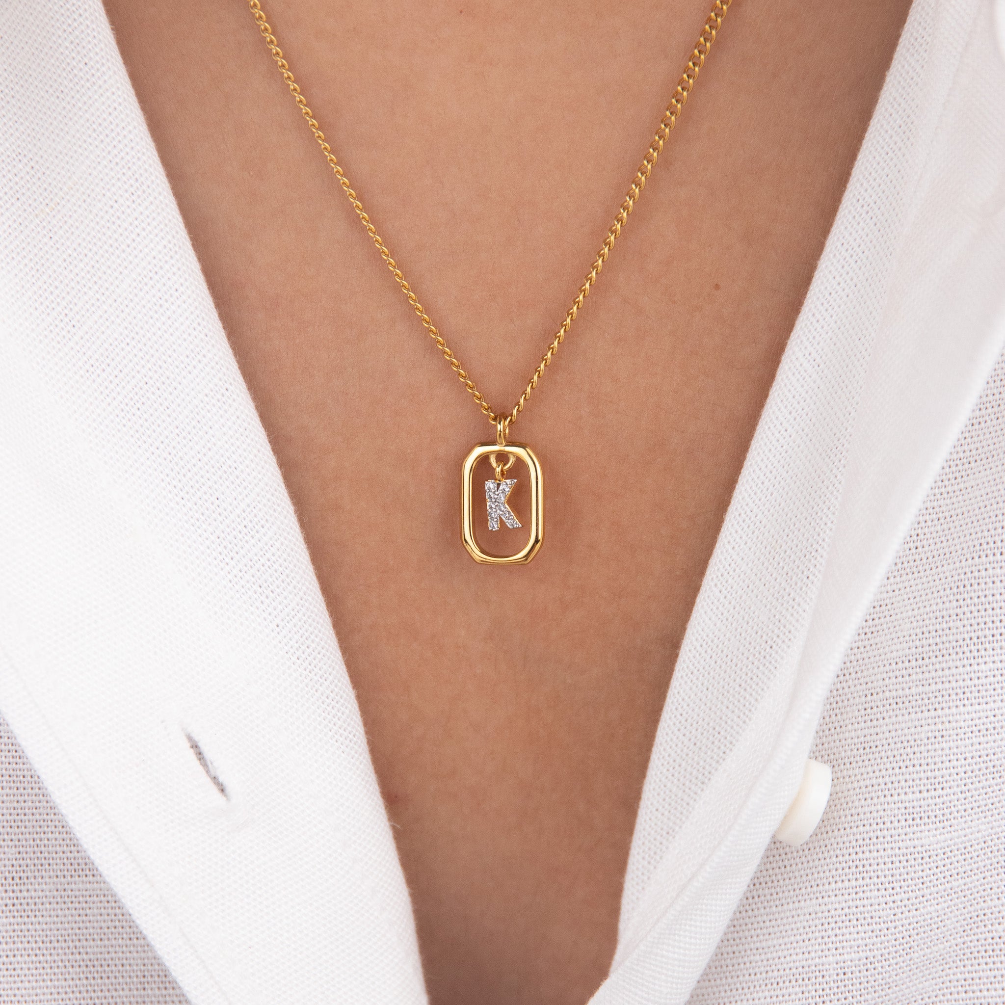 Initial K zirconia necklace worn on neck – personalized luxury jewelry VECINO