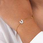 Initial V zirconia bracelet worn on wrist – personalized luxury jewelry VECINO