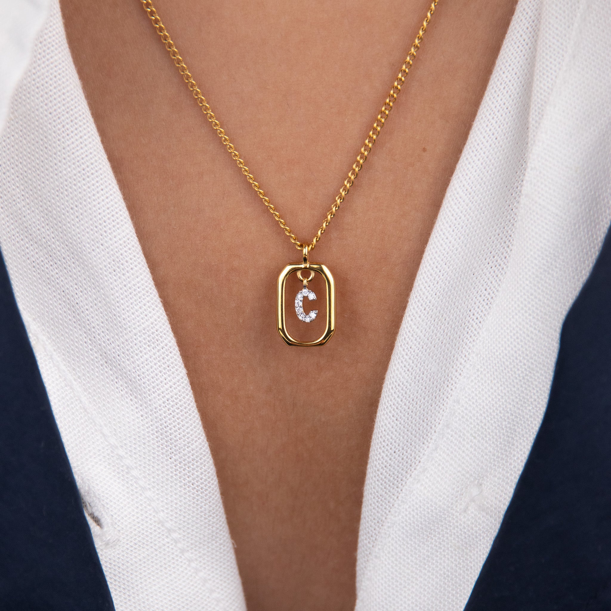 Initial C zirconia necklace worn on neck – personalized luxury jewelry VECINO