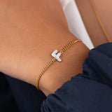 Initial F zirconia bracelet worn on wrist – personalized luxury jewelry VECINO