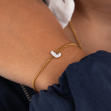 Initial L zirconia bracelet worn on wrist – personalized luxury jewelry VECINO