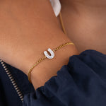 Initial U zirconia bracelet worn on wrist – personalized luxury jewelry VECINO