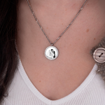 Silver zirconia round necklace photo flat lay – luxury jewelry VECINO