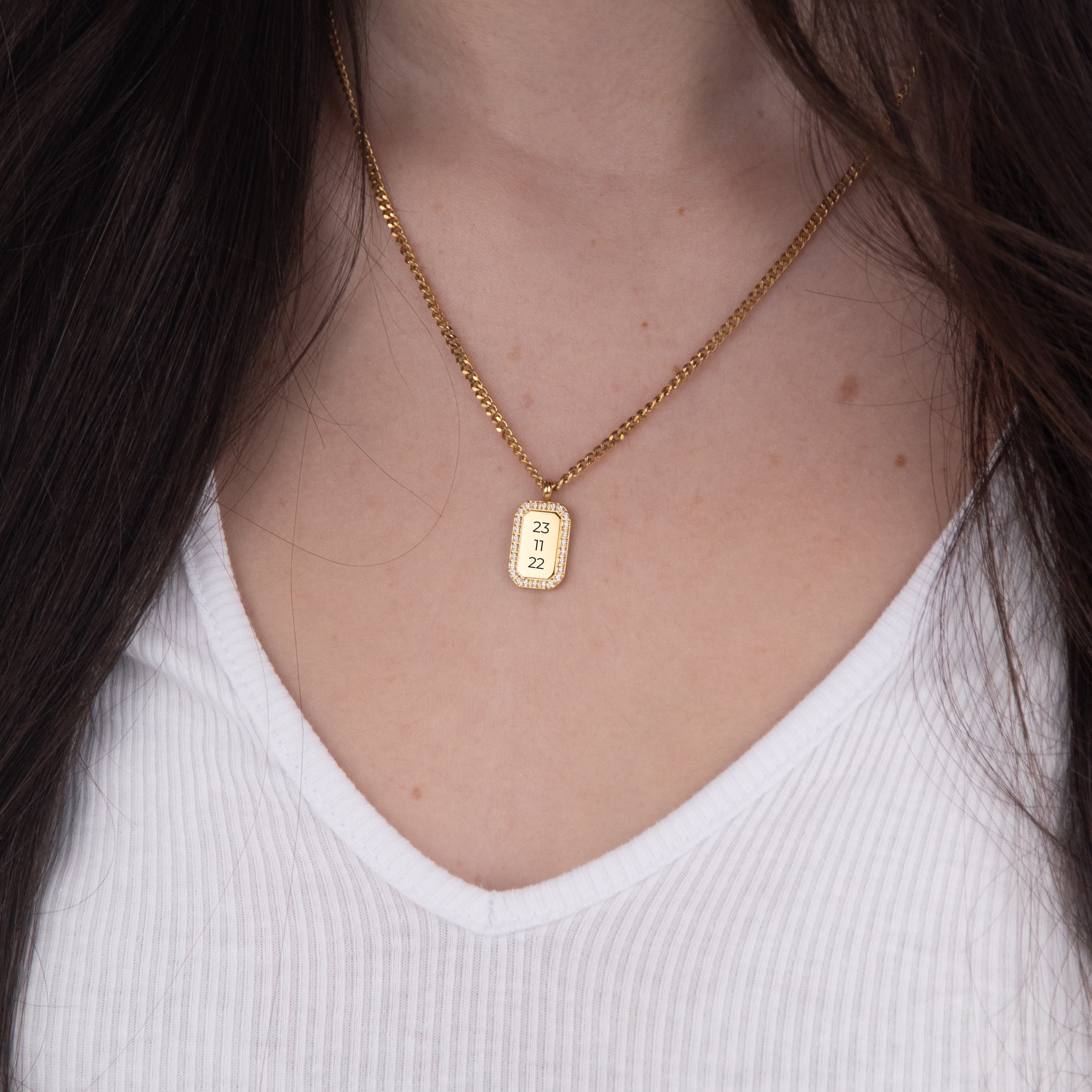 Gold zirconia square necklace text flat lay – 18K personalized jewelry VECINO