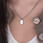 Silver zirconia square necklace text flat lay – personalized engraved jewelry VECINO